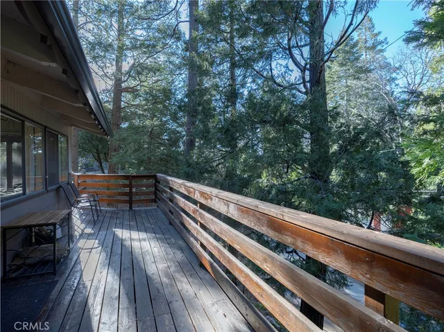 a view of house with roof deck and living area