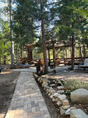 a view of a house with a balcony and tree