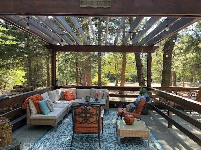 a view of a dry yard with mountains in the background