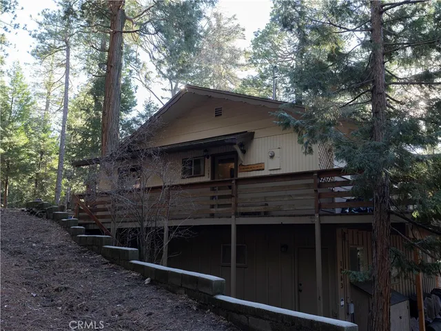 a living room with furniture fireplace and a large window