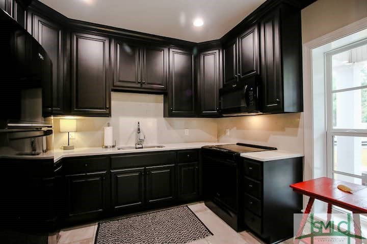 560 Tivoli Trail Road Richmond Hill, GA 31324 - Photo 33 of 48 Stocked with dish ware, cutlery, pots, and linens