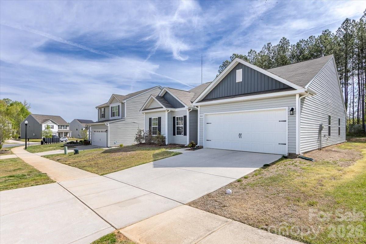 4322 One Mile Way Charlotte, NC 28215 - Photo 2 of 48 a view of a white house with a street