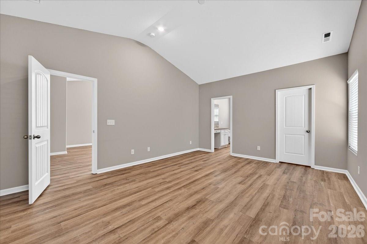4322 One Mile Way Charlotte, NC 28215 - Photo 24 of 48 a view of an empty room with wooden floor and closet
