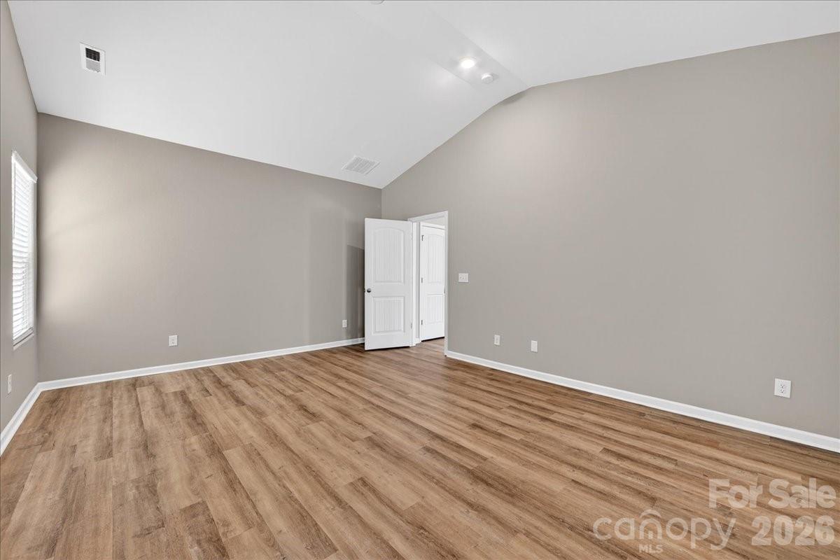 4322 One Mile Way Charlotte, NC 28215 - Photo 28 of 48 a view of an empty room with wooden floor