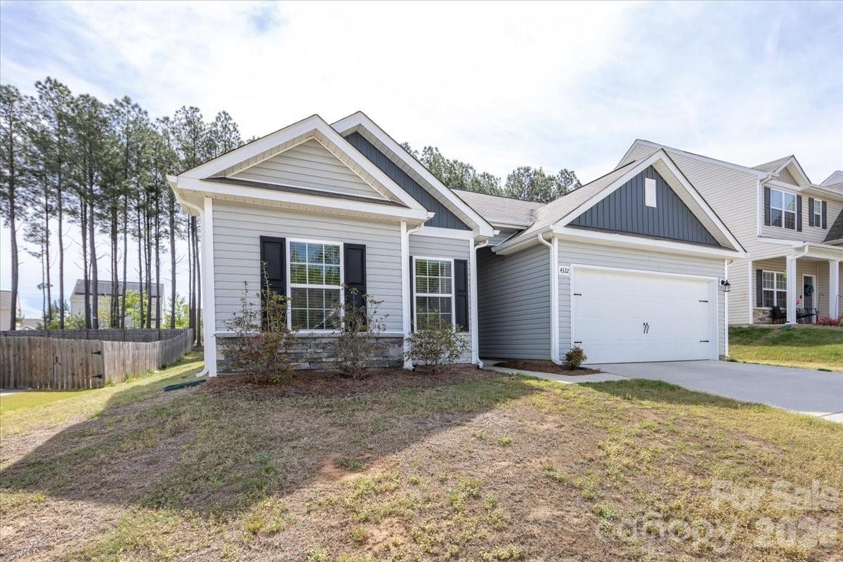 4322 One Mile Way Charlotte, NC 28215 - Photo 3 of 48 a view of a house with garden