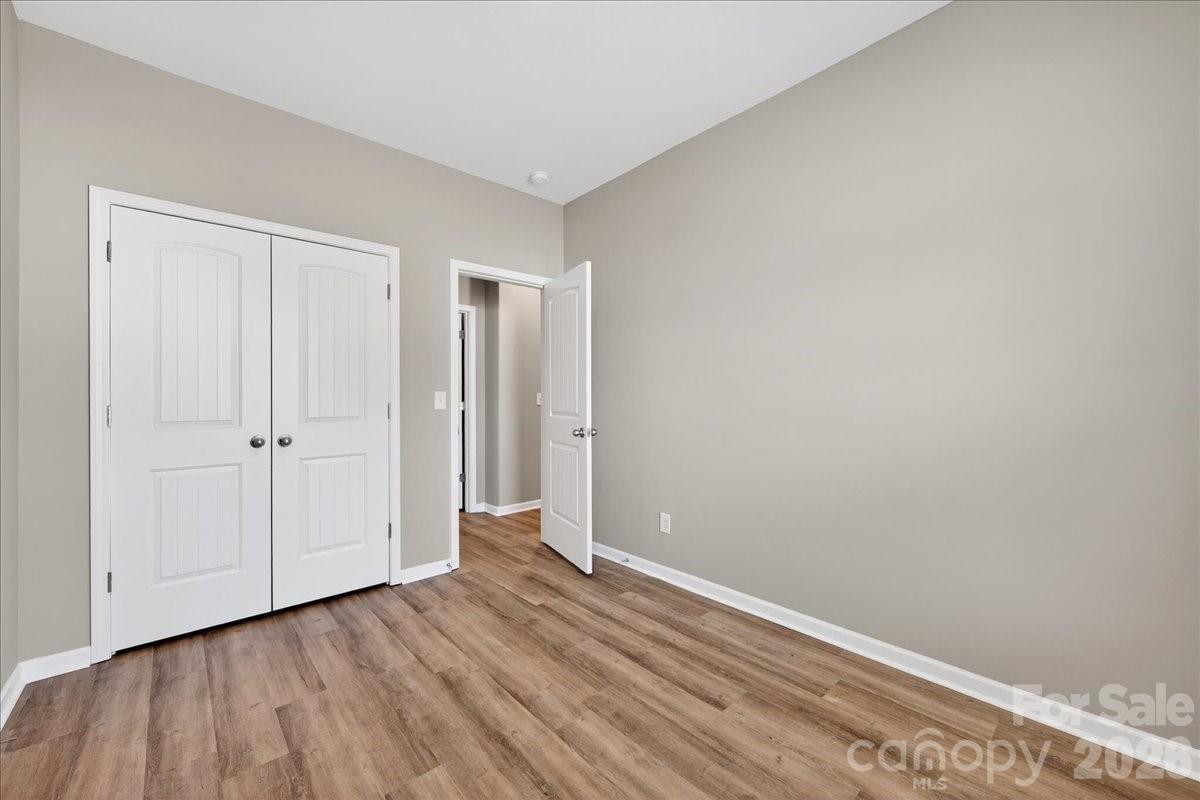 4322 One Mile Way Charlotte, NC 28215 - Photo 36 of 48 a view of a room with wooden floor
