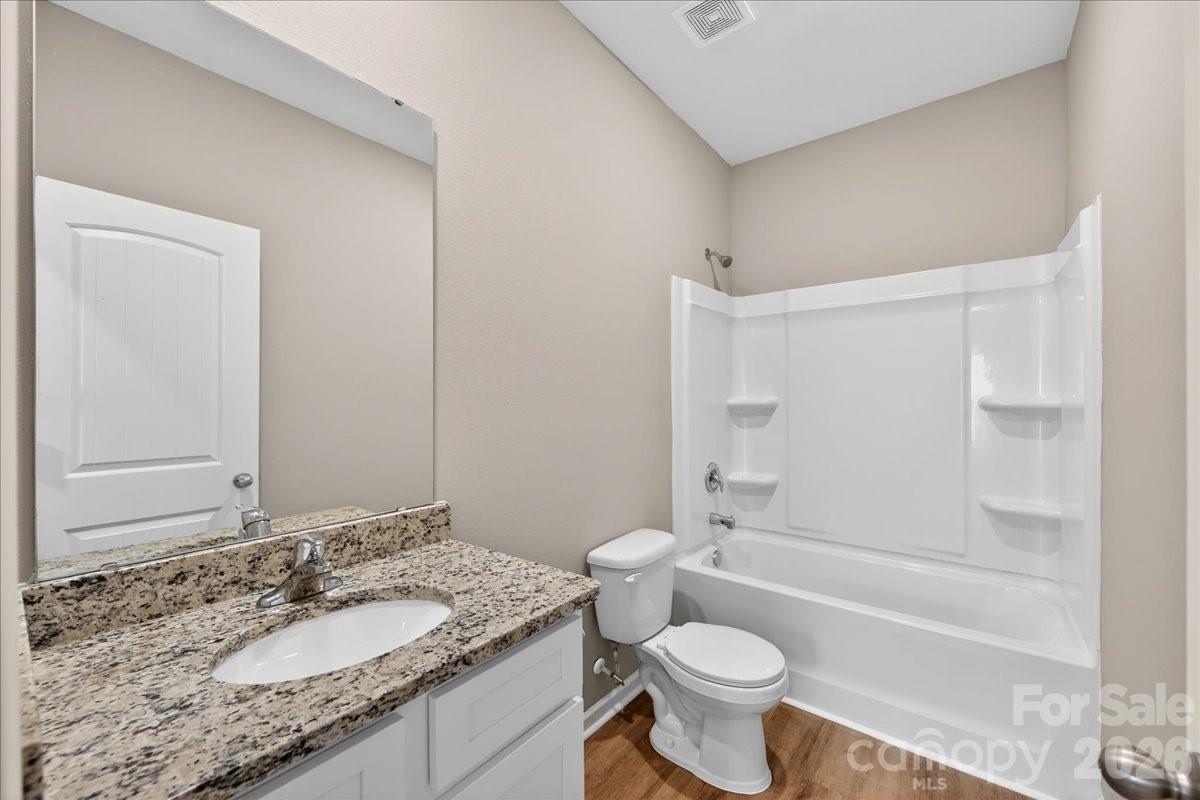 4322 One Mile Way Charlotte, NC 28215 - Photo 37 of 48 a bathroom with a granite countertop sink toilet tub and shower