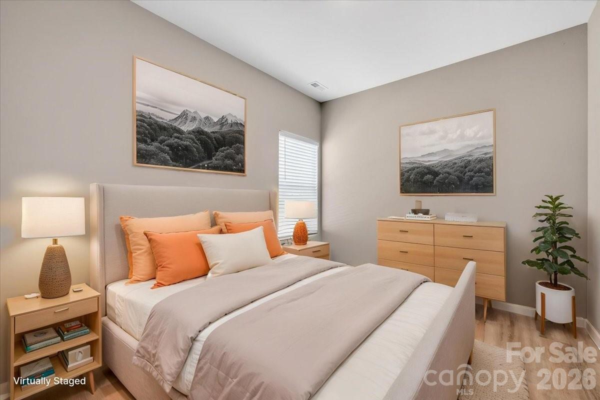 4322 One Mile Way Charlotte, NC 28215 - Photo 38 of 48 a bedroom with a bed and a flat screen tv
