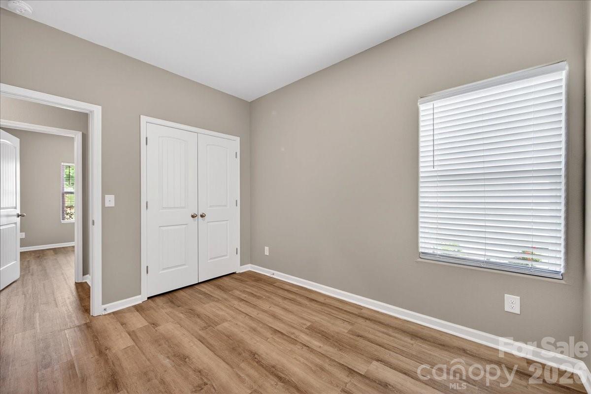 4322 One Mile Way Charlotte, NC 28215 - Photo 40 of 48 a view of a room with wooden floor and a window