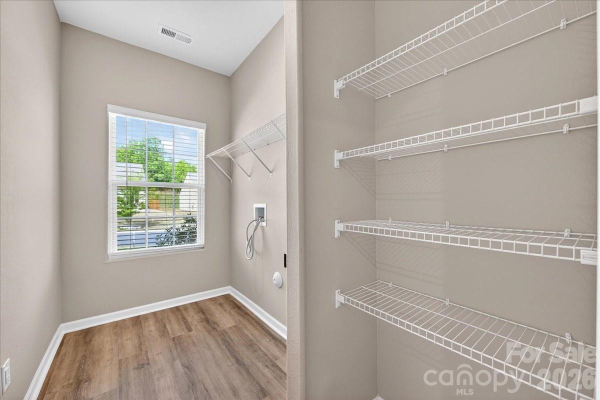 4322 One Mile Way Charlotte, NC 28215 - Photo 42 of 48 a view of an empty room with a window and wooden floor