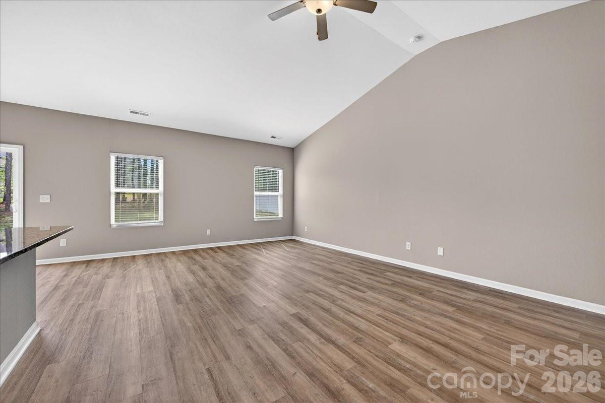 4322 One Mile Way Charlotte, NC 28215 - Photo 9 of 48 wooden floor in an empty room with a window