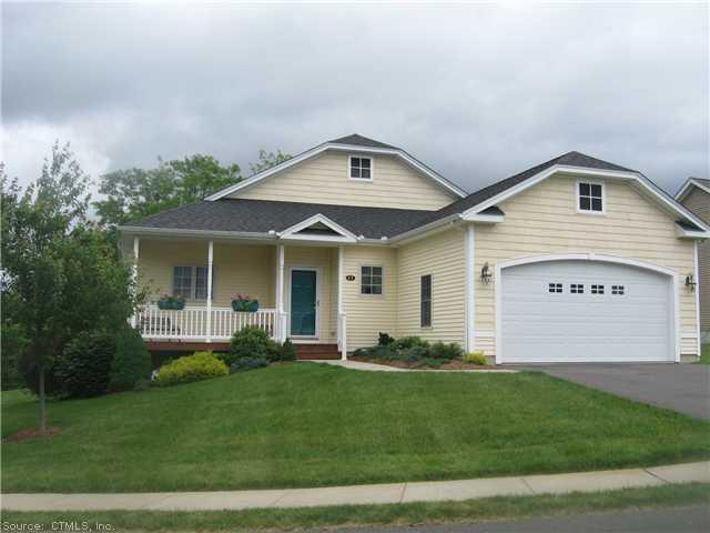 17 Buttonwood Road, Unit 17 Hebron, CT 06248 - Photo 1 of 1 a front view of a house with a yard and porch