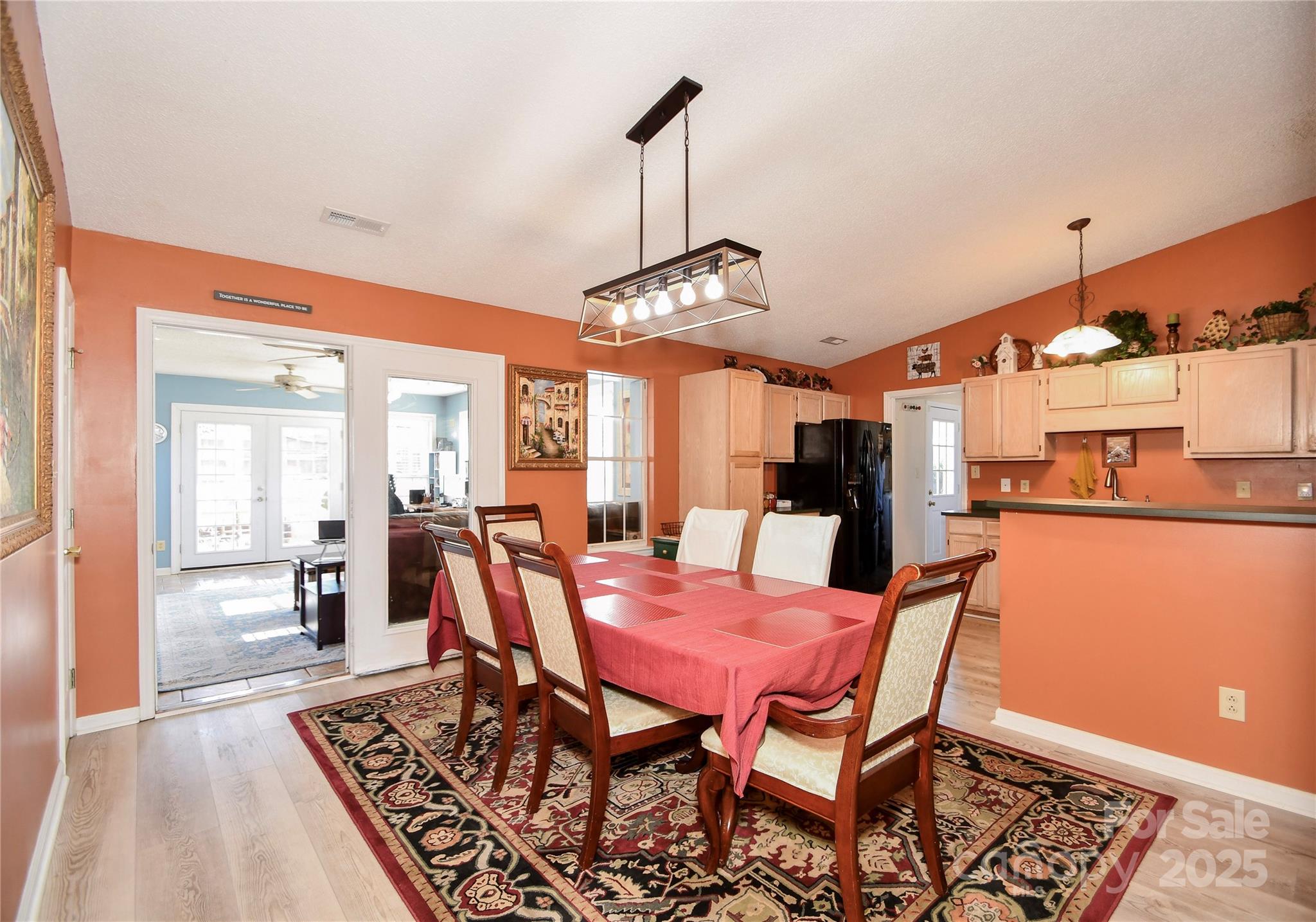 3731 Maple Knoll Drive Monroe, NC 28112 - Photo 14 of 40 a view of a dining room with furniture and wooden floor