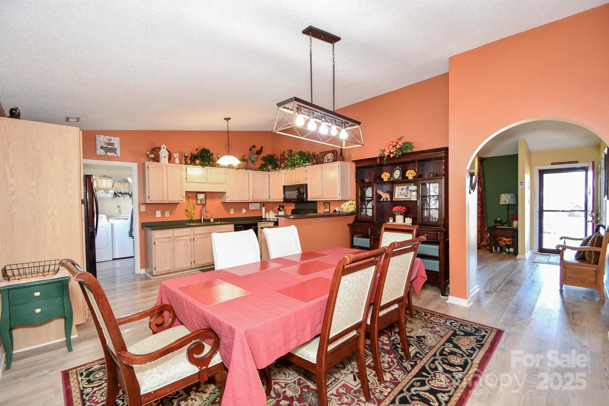 3731 Maple Knoll Drive Monroe, NC 28112 - Photo 15 of 40 a dining room with furniture and wooden floor