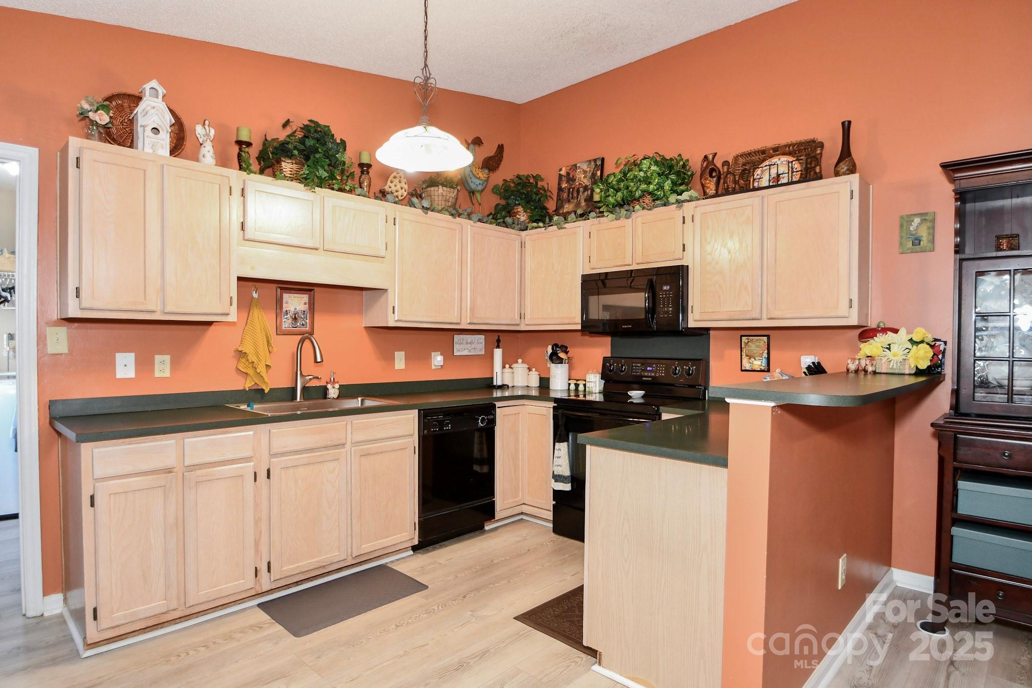 3731 Maple Knoll Drive Monroe, NC 28112 - Photo 16 of 40 a kitchen with a sink stove and refrigerator