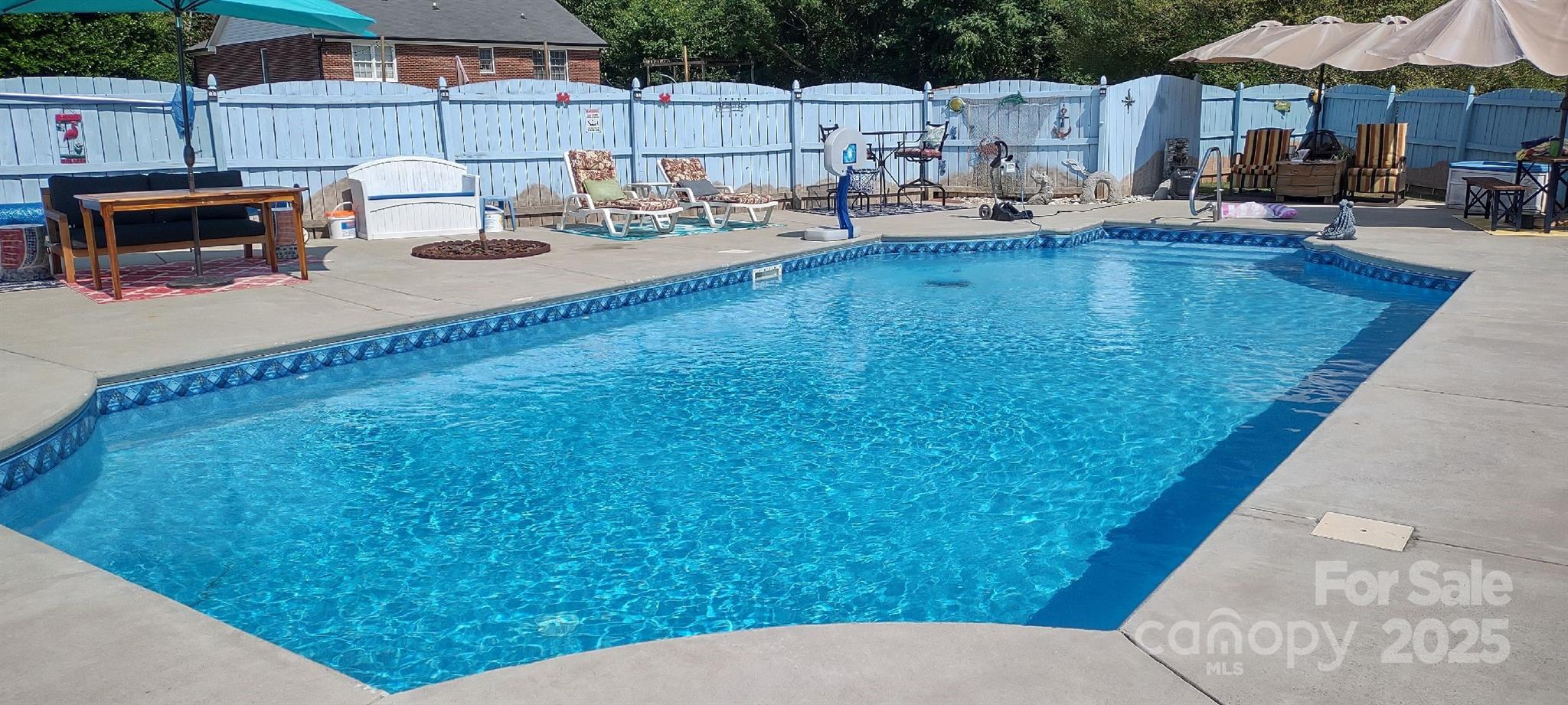 3731 Maple Knoll Drive Monroe, NC 28112 - Photo 39 of 40 a view of a patio with swimming pool table and chairs