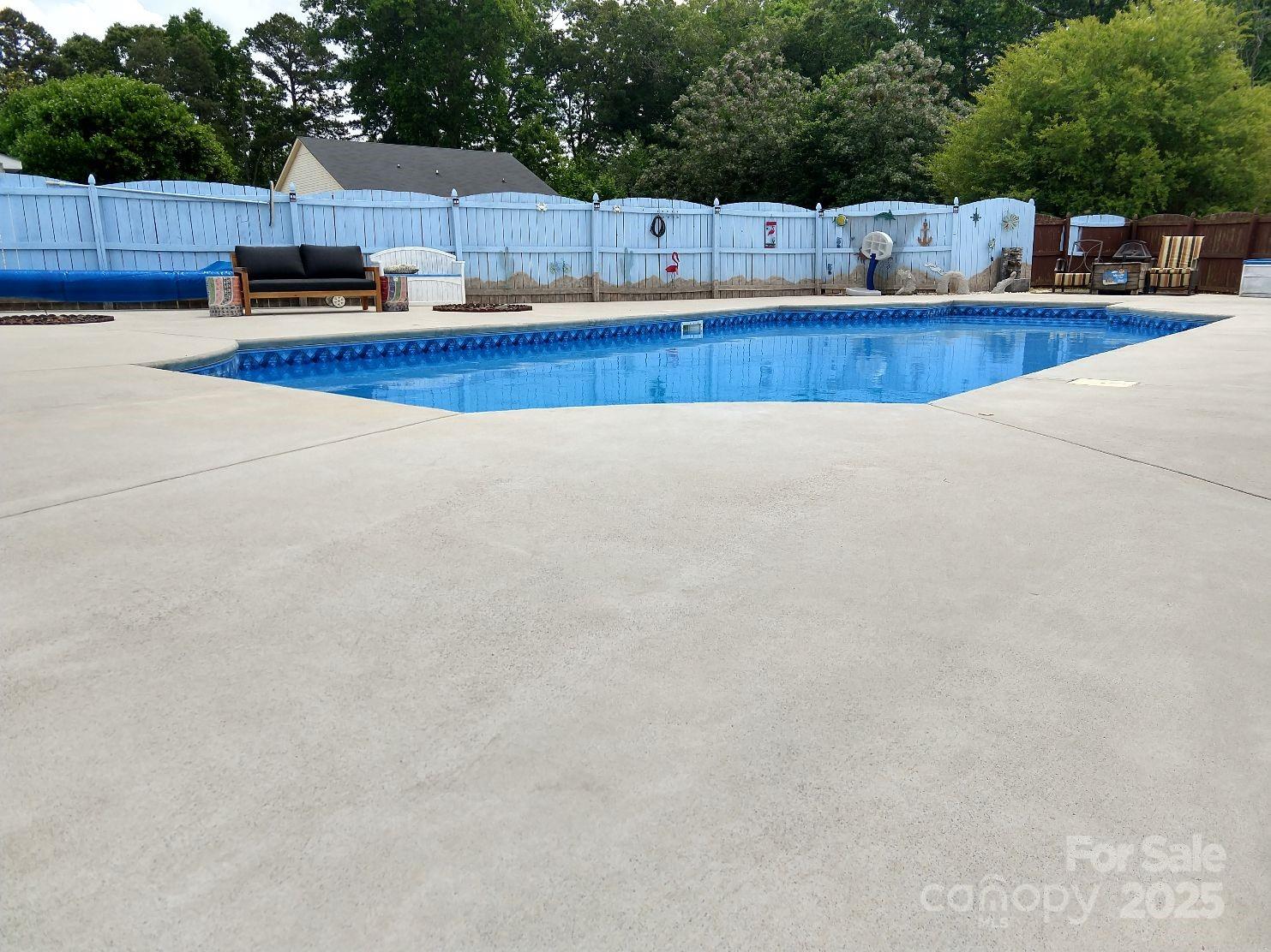 3731 Maple Knoll Drive Monroe, NC 28112 - Photo 40 of 40 a view of a swimming pool and a chair