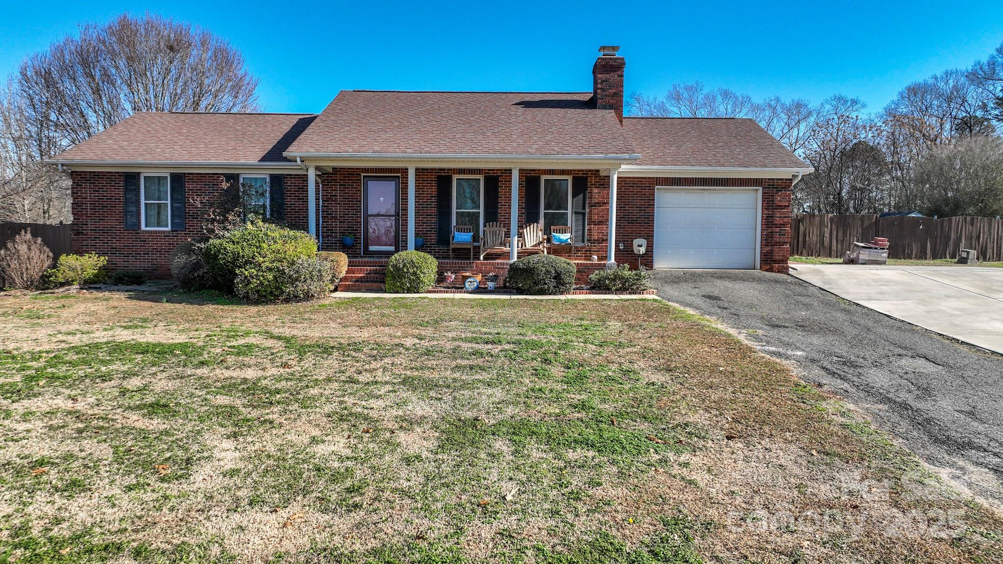 3731 Maple Knoll Drive Monroe, NC 28112 - Photo 8 of 40 a front view of a house with yard and porch