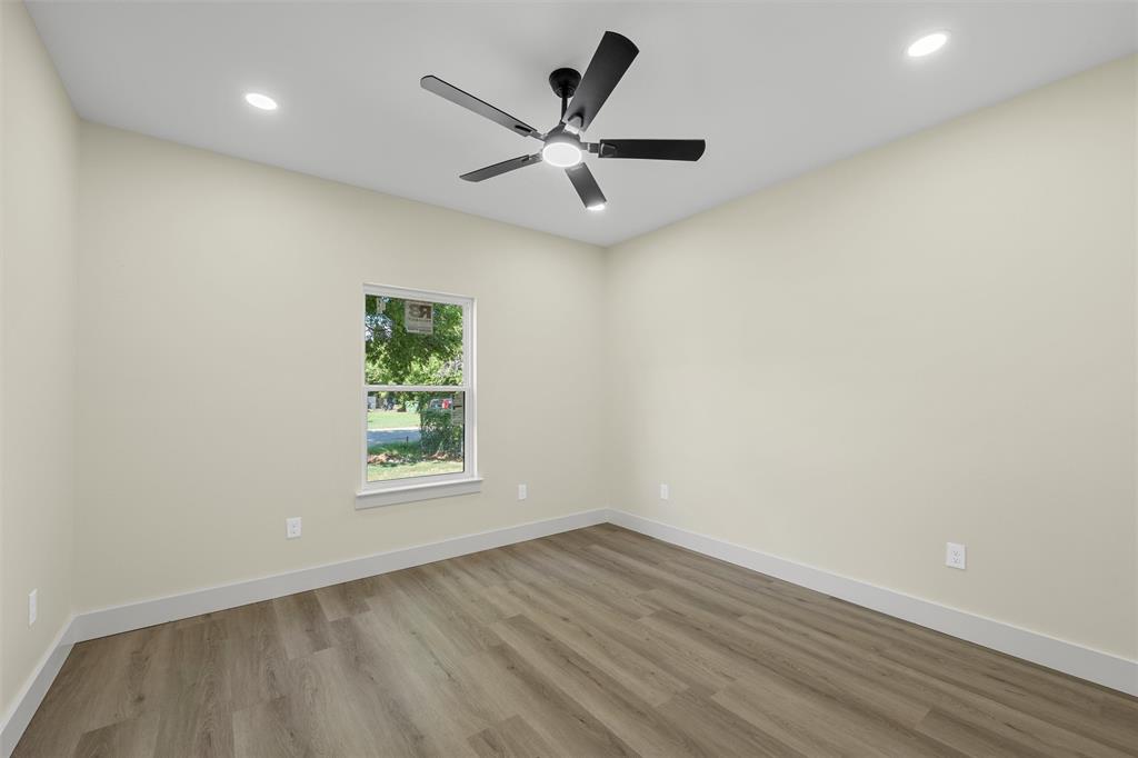 3320 North 27th Street Waco, TX 76708 - Photo 30 of 38 an empty room with wooden floor and windows