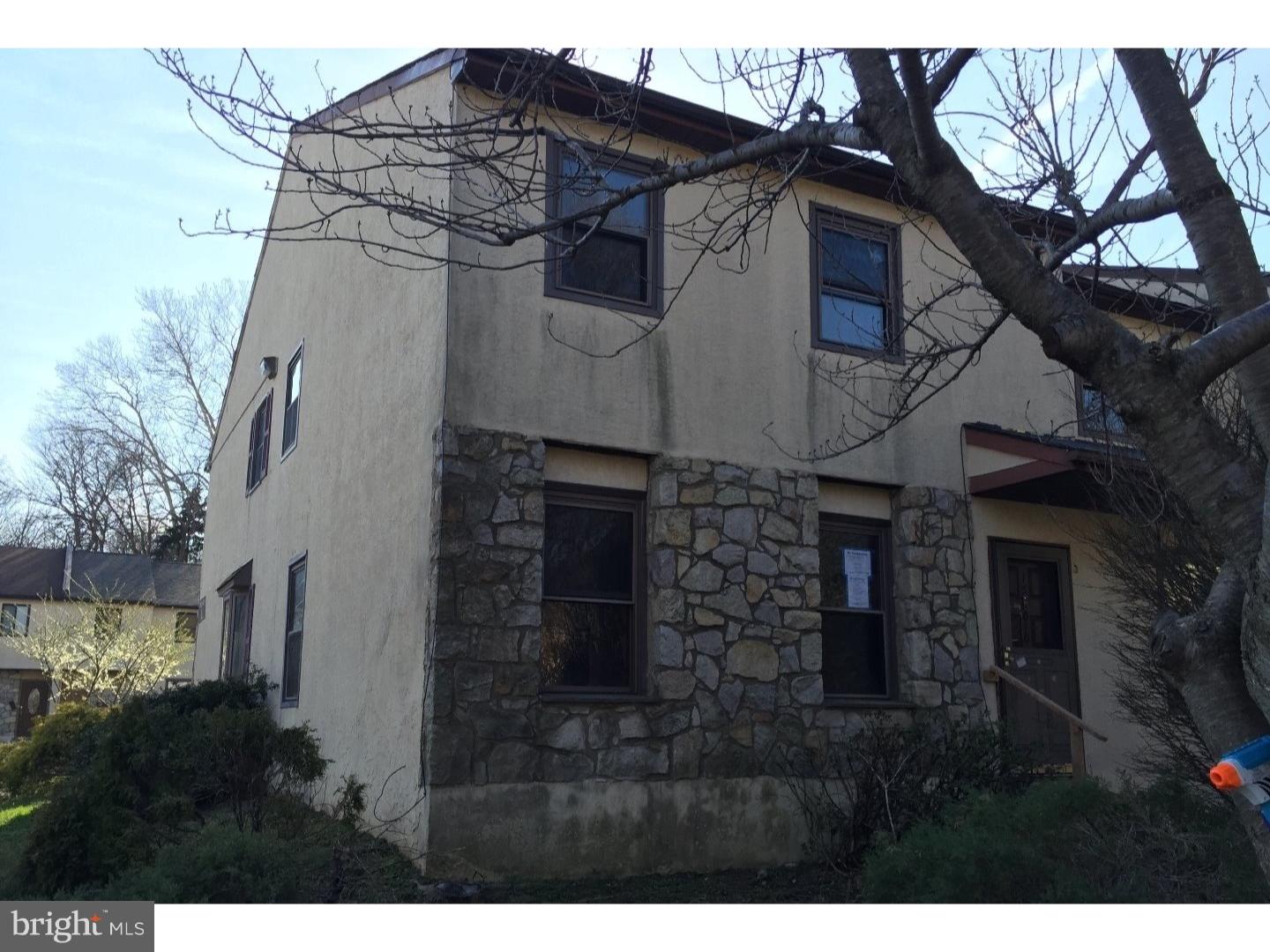 13010 Townsend Road, Unit L1 Philadelphia, PA 19154 - Photo 2 of 16 a view of a white house with a large tree