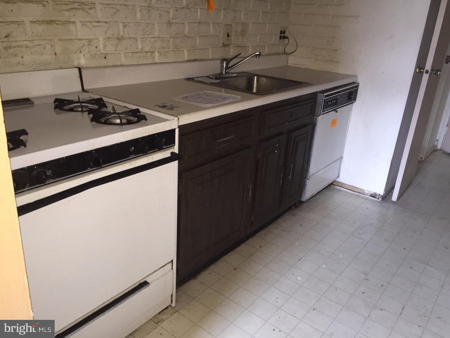 13010 Townsend Road, Unit L1 Philadelphia, PA 19154 - Photo 11 of 16 a kitchen with a sink and cabinets