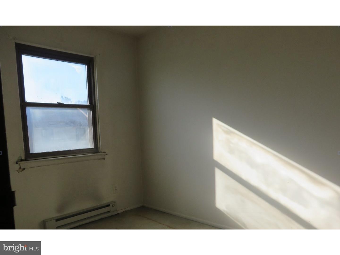 13010 Townsend Road, Unit L1 Philadelphia, PA 19154 - Photo 13 of 16 a view of an empty room and window