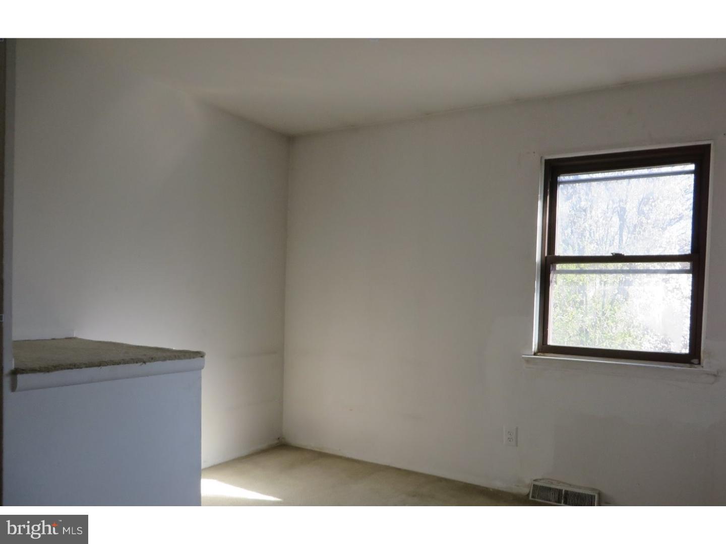 13010 Townsend Road, Unit L1 Philadelphia, PA 19154 - Photo 15 of 16 a view of an empty room with a window
