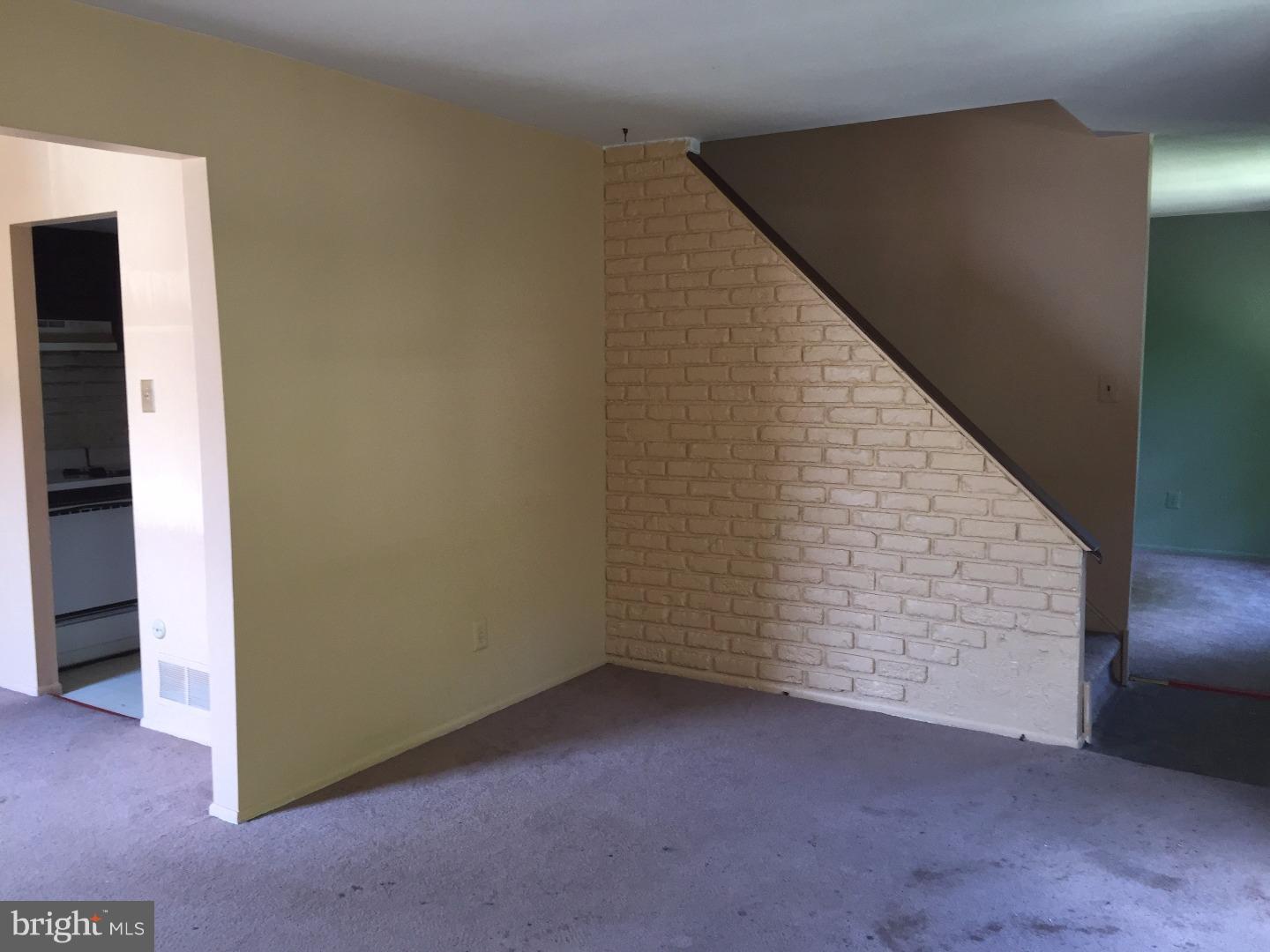 13010 Townsend Road, Unit L1 Philadelphia, PA 19154 - Photo 6 of 16 a view of an empty room with hallway