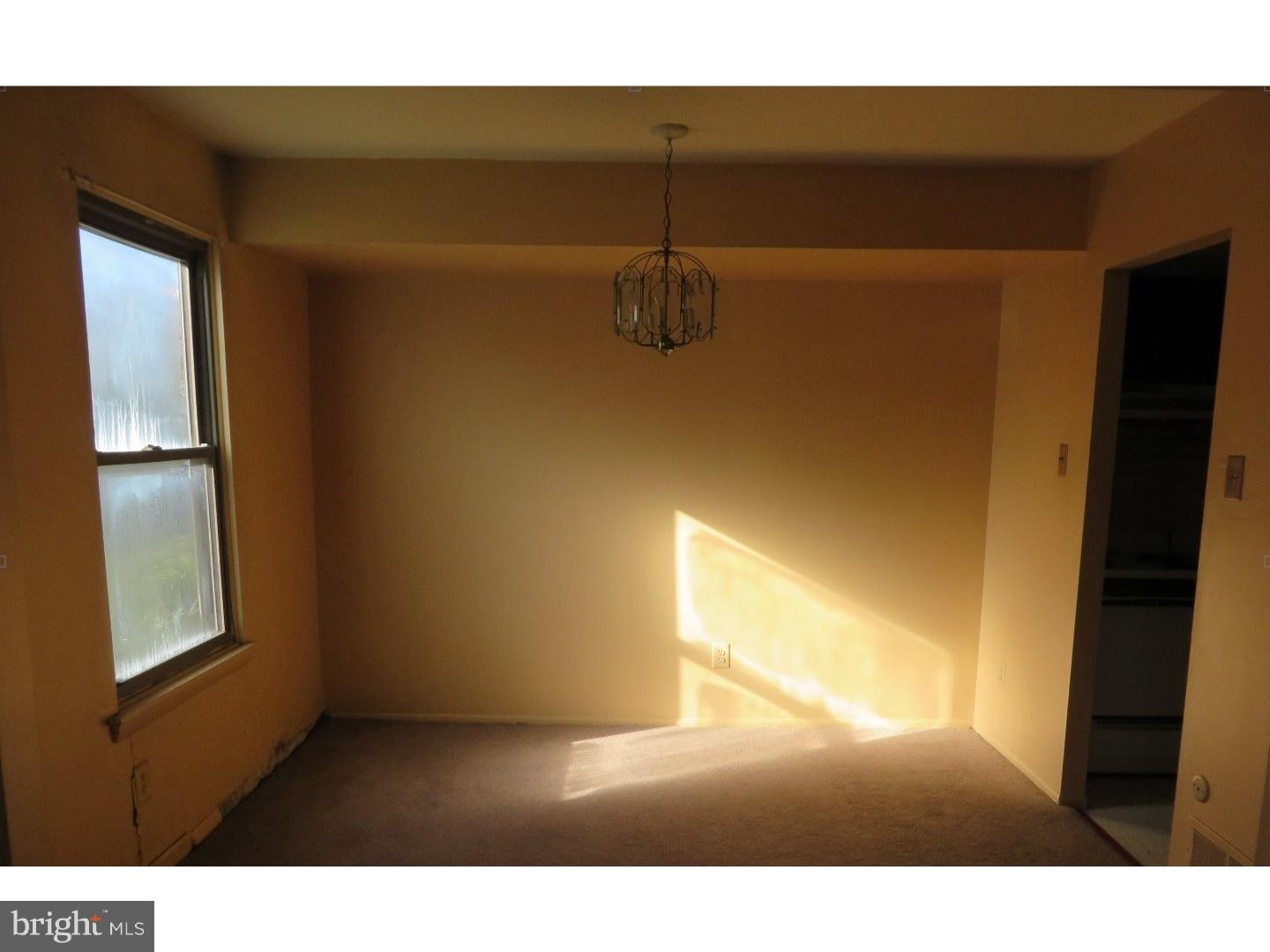 13010 Townsend Road, Unit L1 Philadelphia, PA 19154 - Photo 7 of 16 a view of an empty room and window