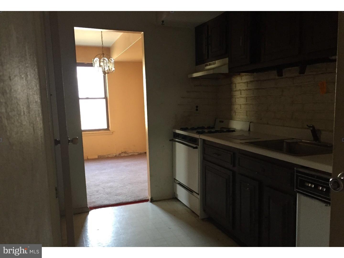 13010 Townsend Road, Unit L1 Philadelphia, PA 19154 - Photo 10 of 16 a kitchen with a wooden floor and a sink
