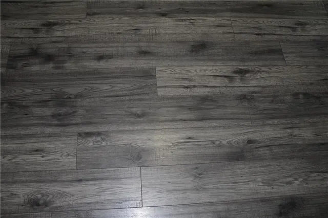 a kitchen with granite countertop white cabinets and a sink