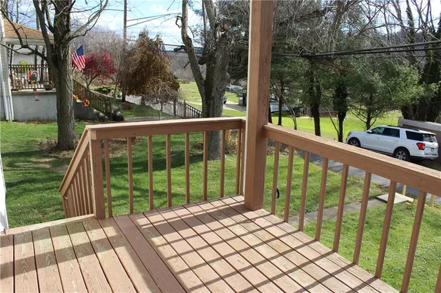 a view of a chair and table in the balcony