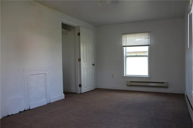 a view of an empty room and window