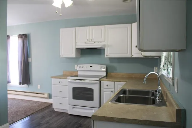 a kitchen with a stove and a sink