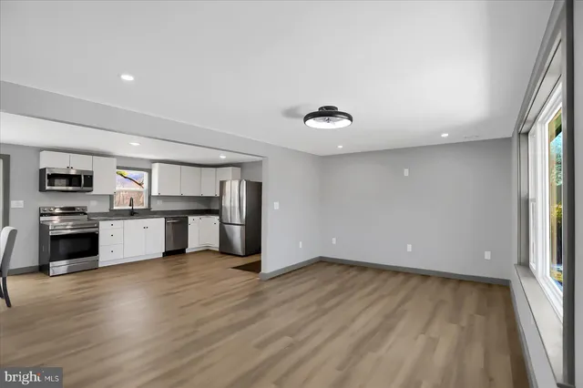 a bathroom with a sink a toilet and a bathtub