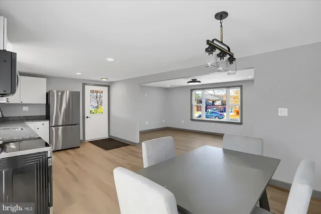 a bathroom with a sink a mirror a toilet and shower