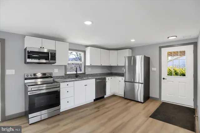 a view of a room with wooden walls