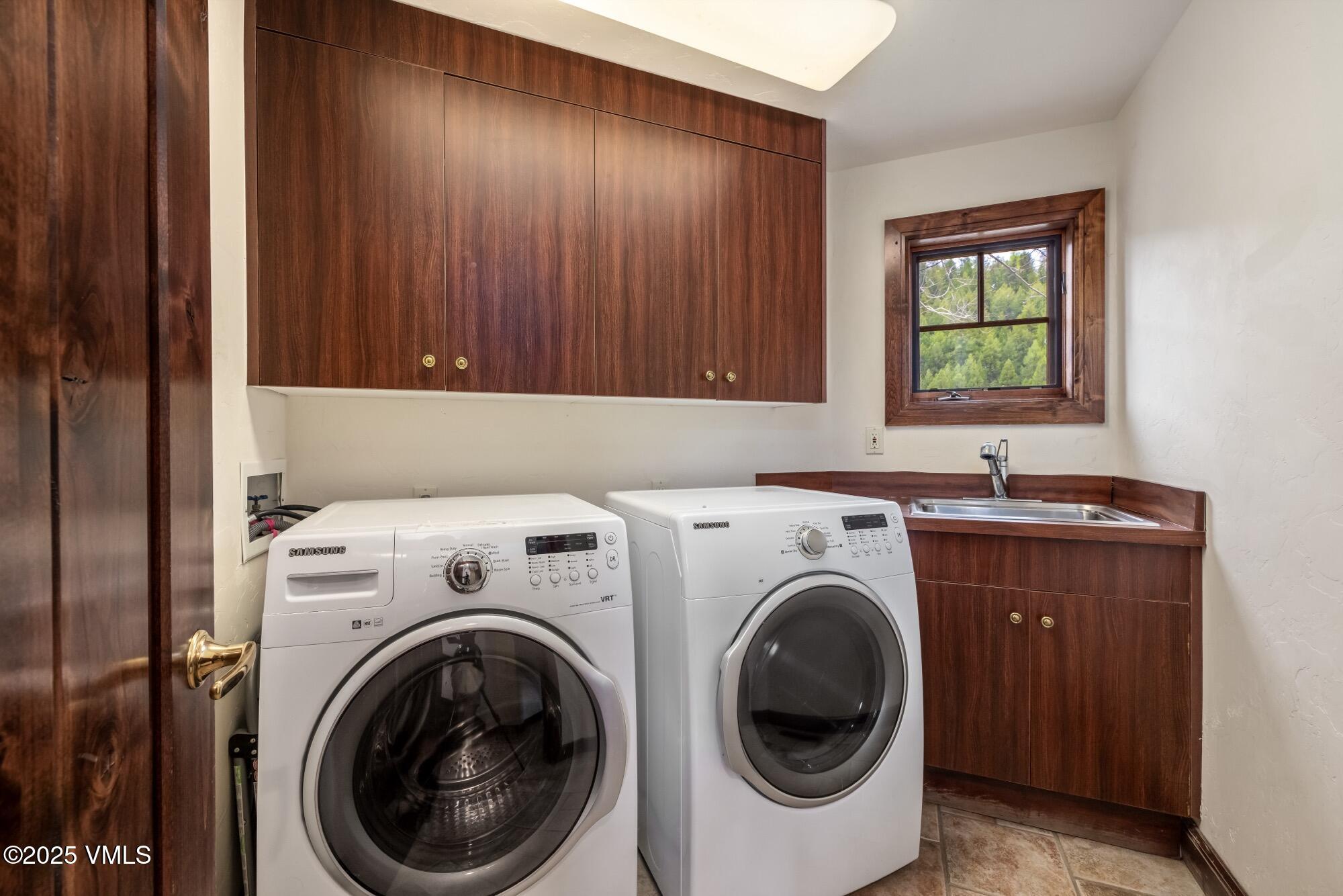 1122 Red Draw Edwards, CO 81632 - Photo 52 of 54 a utility room with dryer washer and a window