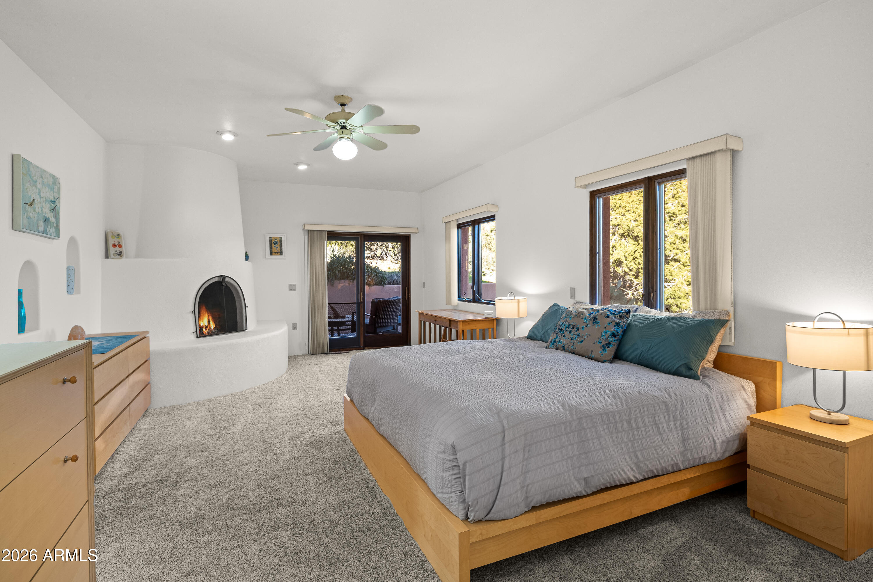 175 Devils Kitchen Drive Sedona, AZ 86351 - Photo 19 of 34 PRIMARY BEDROOM WITH FIREPLACE