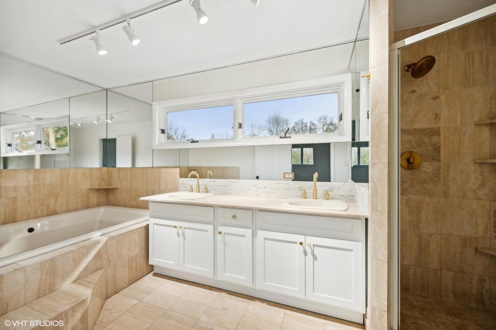 558 Sunset Lane Glencoe, IL 60022 - Photo 12 of 22 a bathroom with a granite countertop sink mirror and bathtub