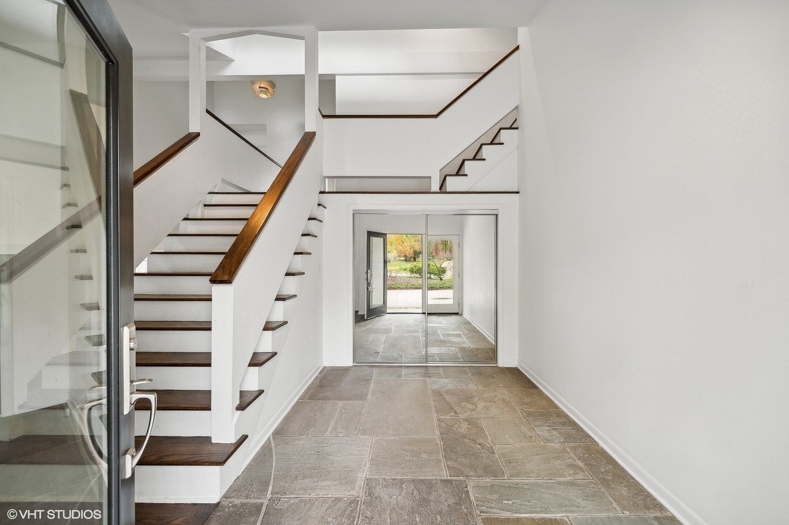 558 Sunset Lane Glencoe, IL 60022 - Photo 2 of 22 a view of entryway with stairs and wooden floor