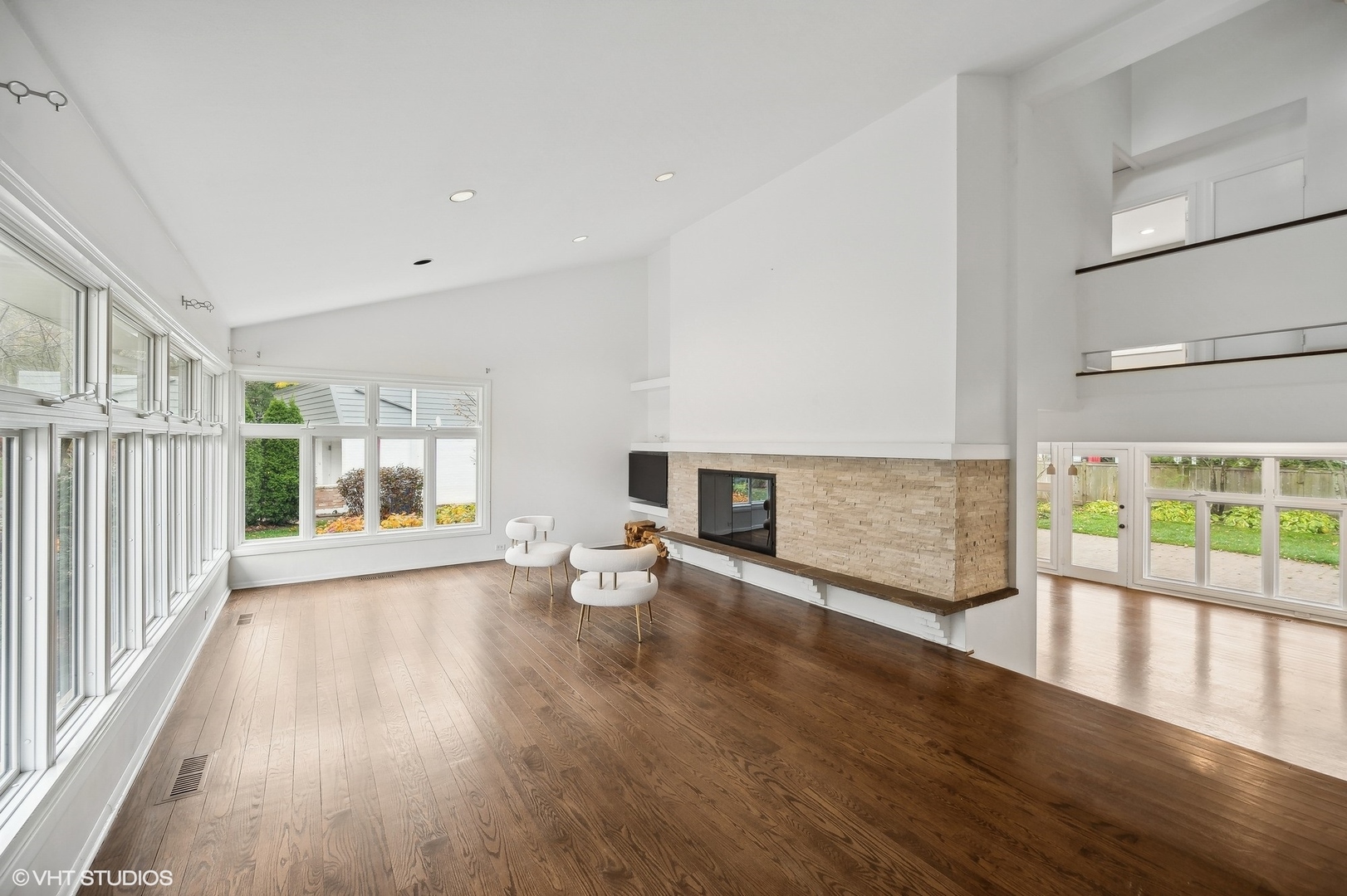 558 Sunset Lane Glencoe, IL 60022 - Photo 4 of 22 a view of an empty room with wooden floor and a window