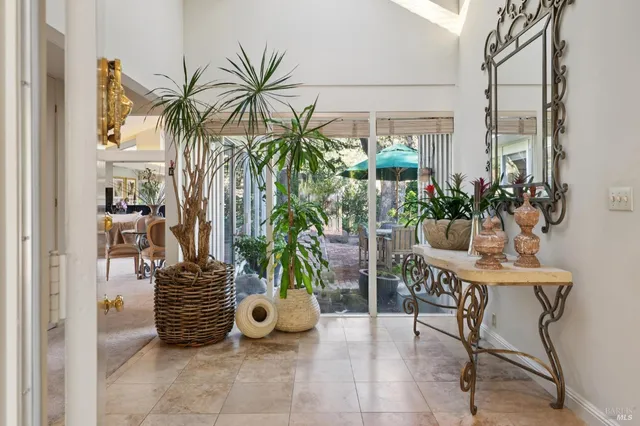 a view of a chairs and table in a patio
