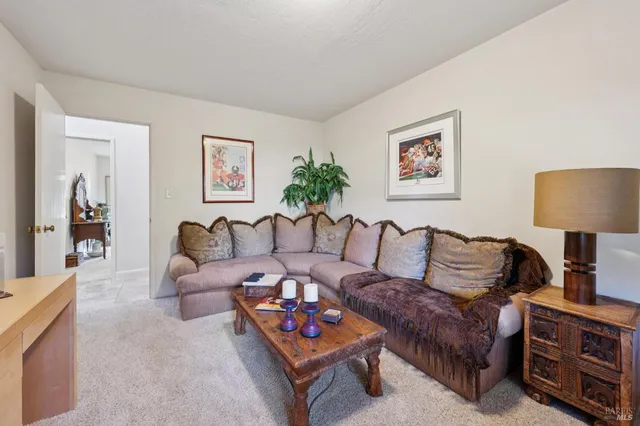 a bedroom with a bed a mirror and a window