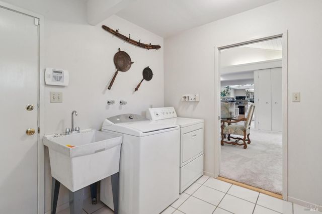 a view of house with backyard and outdoor seating