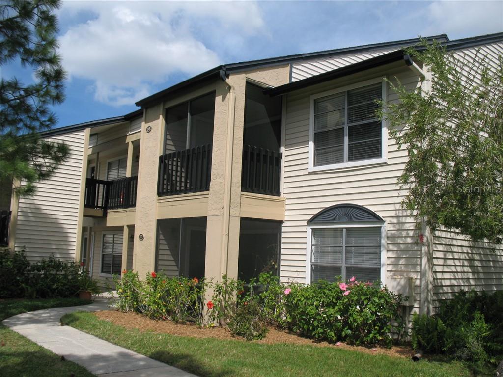 500 South Belcher Road, Unit 218 Largo, FL 33771 - Photo 1 of 1 a front view of a house with garden