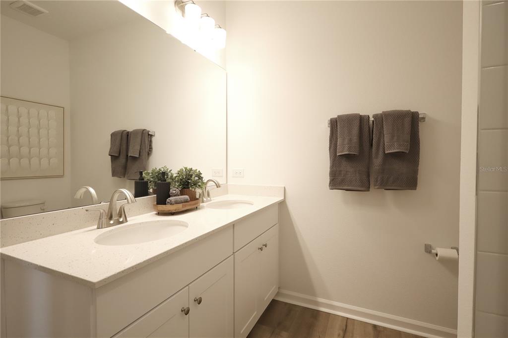 5719 Hiawassee Road Yalaha, FL 34797 - Photo 15 of 20 a bathroom with a sink and a mirror