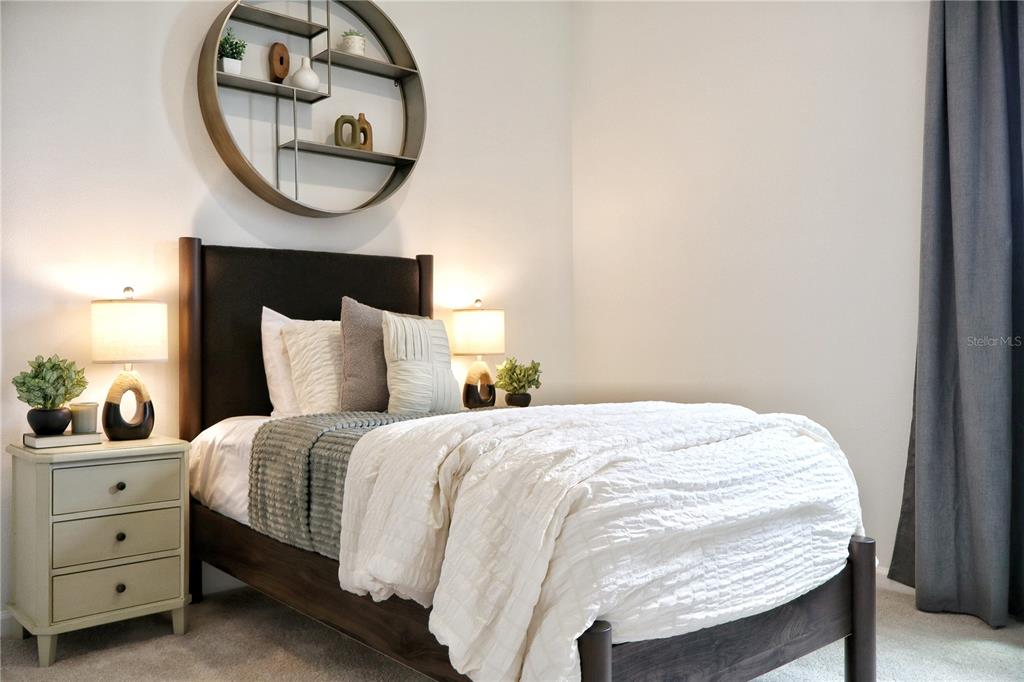 5719 Hiawassee Road Yalaha, FL 34797 - Photo 17 of 20 a bedroom with a bed and a mirror