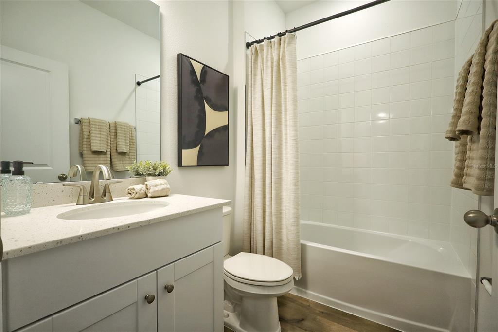 5719 Hiawassee Road Yalaha, FL 34797 - Photo 20 of 20 a bathroom with a sink toilet and shower