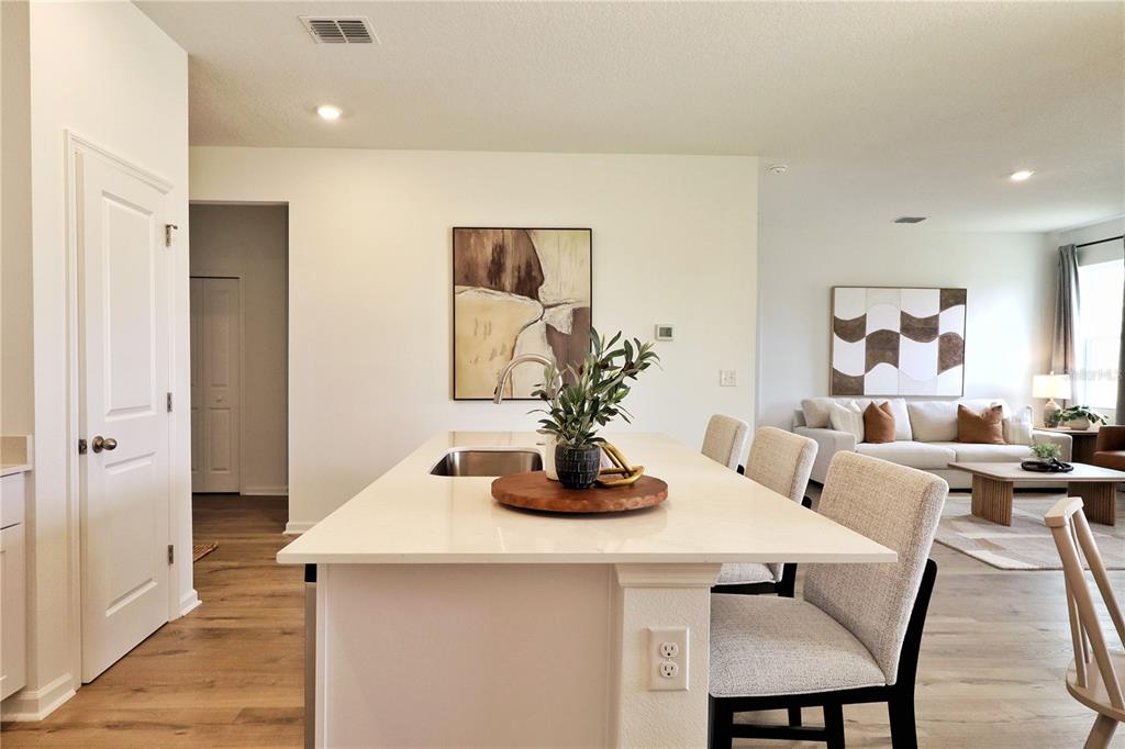 5719 Hiawassee Road Yalaha, FL 34797 - Photo 3 of 20 a dining room with furniture and wooden floor
